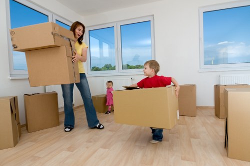 Professional movers packing and loading a van