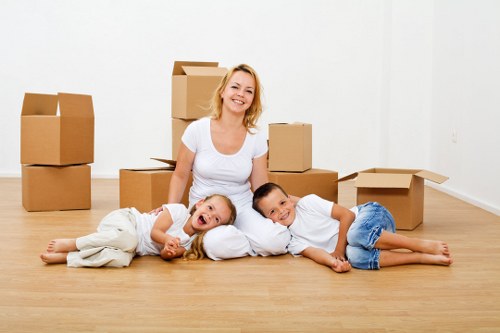 Professional movers handling furniture in West Hampstead